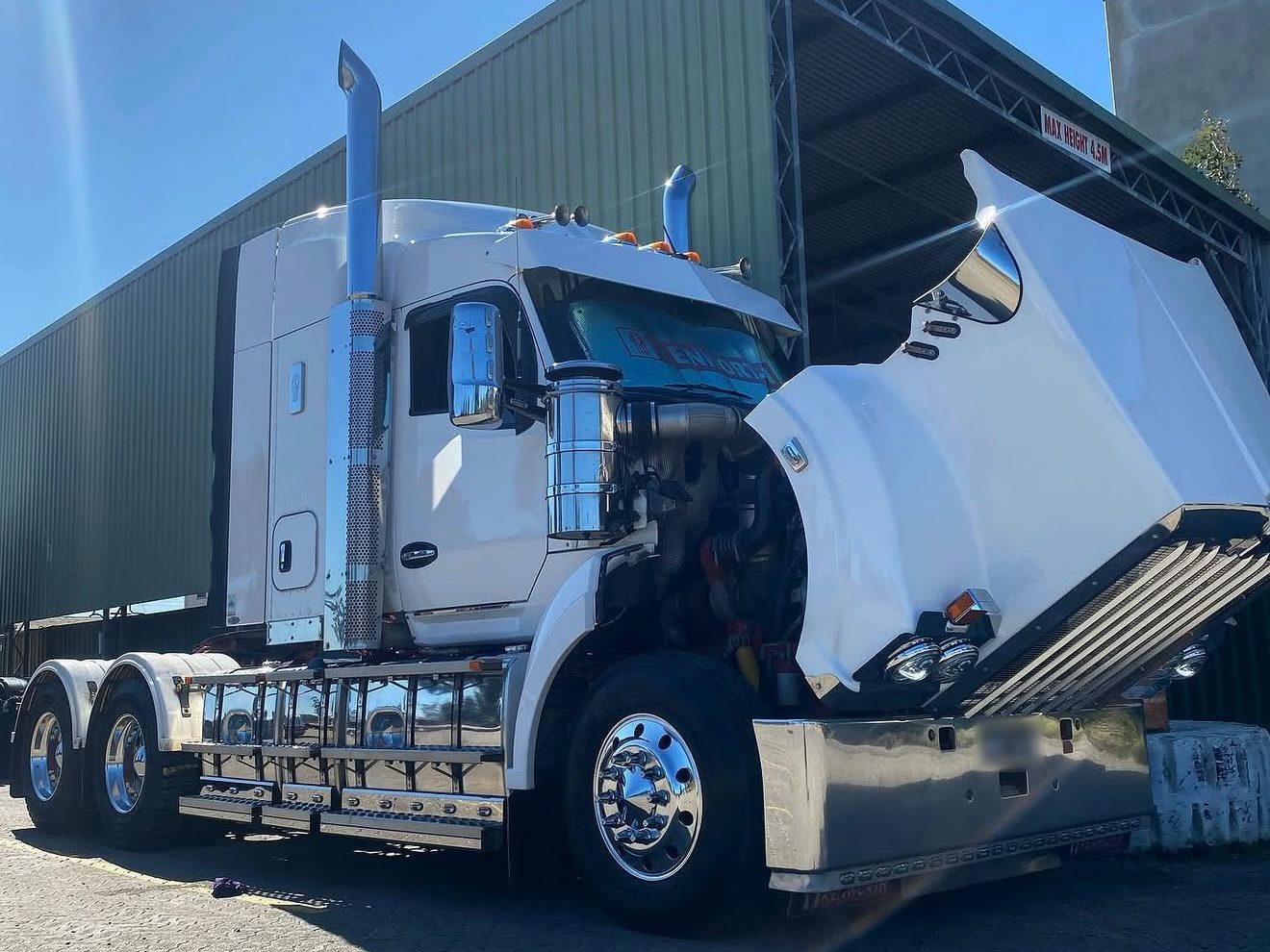 Kenworth prime mover with the bonnet up for on-site repair work