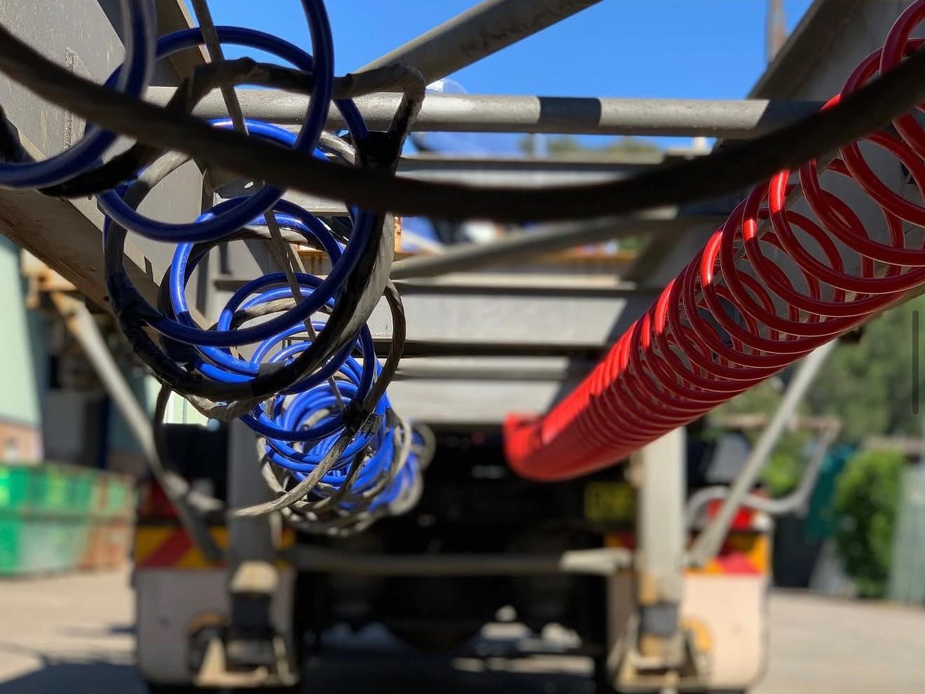 Trailer air and electrical lines behind a prime mover